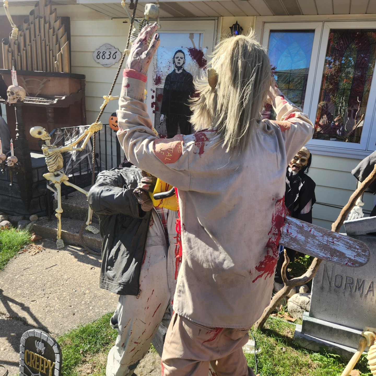 Horror figures and skeletons in front of the house marked 8836 on 51st Avenue — Hills of Unrest, October 2024.